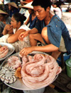 Selling snakes in a market in Vietnam...